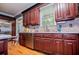 A well-equipped kitchen features stainless steel appliances and lots of wooden cabinet space at 6919 Mount Zion Rd, Waco, GA 30182