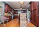 A spacious kitchen is styled with stainless steel appliances, wood cabinets, and a breakfast bar at 6919 Mount Zion Rd, Waco, GA 30182