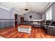 Spacious living room features a vaulted ceiling, hardwood floors and a large leather couch at 6919 Mount Zion Rd, Waco, GA 30182