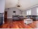 Spacious living room features a vaulted ceiling, hardwood floors and a large leather couch at 6919 Mount Zion Rd, Waco, GA 30182