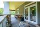 Outdoor porch features a grill, table and chairs, and access to inside the home at 6919 Mount Zion Rd, Waco, GA 30182