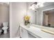 Bright bathroom featuring white cabinets, and a large mirror at 8740 Roswell Rd # 2G, Atlanta, GA 30350