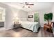Bedroom with wood-look floors, neutral paint, and an ensuite bathroom at 8740 Roswell Rd # 2G, Atlanta, GA 30350