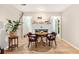 Cozy dining area featuring hardwood floors, fireplace and abundant natural light at 8740 Roswell Rd # 2G, Atlanta, GA 30350