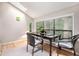 Inviting dining space with large windows, skylight, and ample natural light, perfect for meals at 8740 Roswell Rd # 2G, Atlanta, GA 30350