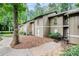 Charming townhome featuring a well-maintained lawn, mature trees and a serene, wooded setting at 8740 Roswell Rd # 2G, Atlanta, GA 30350