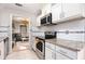 Updated kitchen featuring white cabinets, stainless steel appliances, and granite countertops at 8740 Roswell Rd # 2G, Atlanta, GA 30350