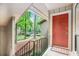 Inviting front porch with a vibrant red door, offering a warm welcome to visitors at 8740 Roswell Rd # 2G, Atlanta, GA 30350