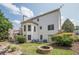 Expansive backyard with a lovely pool area, lush landscaping, and relaxing fire pit feature at 113 Gold Bridge Xing, Canton, GA 30114