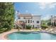 Resort-style backyard features a large in-ground pool and a spacious deck with outdoor seating at 113 Gold Bridge Xing, Canton, GA 30114