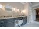 Vanity area with a double sink, granite countertop, and decorative lighting at 113 Gold Bridge Xing, Canton, GA 30114