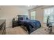 Bedroom featuring carpet, a bed, and a window letting in natural light at 113 Gold Bridge Xing, Canton, GA 30114