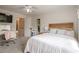 Bright bedroom with a modern vanity, natural light, and a doorway to an adjoining room at 113 Gold Bridge Xing, Canton, GA 30114