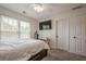 This bedroom features a ceiling fan, windows and space for a desk at 113 Gold Bridge Xing, Canton, GA 30114