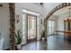 Grand foyer featuring stone archway details, hardwood floors and high ceilings at 113 Gold Bridge Xing, Canton, GA 30114