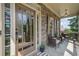 Relaxing front porch with stone accents and comfortable seating at 113 Gold Bridge Xing, Canton, GA 30114