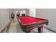 This expansive game room features a pool table and luxury vinyl plank flooring at 113 Gold Bridge Xing, Canton, GA 30114