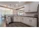 Bright kitchen with granite countertops, white cabinets, and stainless steel dishwasher at 113 Gold Bridge Xing, Canton, GA 30114