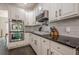 Gourmet kitchen with stainless steel appliances, granite countertops, and white cabinets at 113 Gold Bridge Xing, Canton, GA 30114