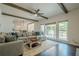Bright and open living room with large windows and access to a deck for outdoor living at 113 Gold Bridge Xing, Canton, GA 30114