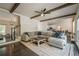 Spacious living room with hardwood floors, a staircase, and an open view to the kitchen at 113 Gold Bridge Xing, Canton, GA 30114