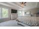 Spacious main bedroom boasts natural light, plush carpet, and a large dresser with mirror at 113 Gold Bridge Xing, Canton, GA 30114