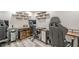 This office features multiple desks, custom wood shelving, and comfortable seating at 113 Gold Bridge Xing, Canton, GA 30114