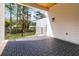 Beautiful back porch with tile flooring, wood ceiling, black railings, and lots of room for outdoor living at 1554 Columbia Cir, Decatur, GA 30032