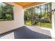 Beautiful back porch featuring tile flooring, wood ceiling, black railings, and a backyard view at 1554 Columbia Cir, Decatur, GA 30032