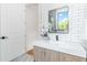 Stylish bathroom featuring subway tiles, floating vanity, and modern black fixtures at 1554 Columbia Cir, Decatur, GA 30032