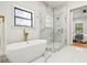 Luxury bathroom features a freestanding tub, glass-enclosed shower, and elegant marble accents at 1554 Columbia Cir, Decatur, GA 30032