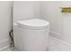 Modern toilet with sleek white finish and minimalist design in a stylish bathroom at 1554 Columbia Cir, Decatur, GA 30032