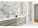 Bright bathroom featuring dual sinks, modern fixtures, and stylish hexagon marble accent wall at 1554 Columbia Cir, Decatur, GA 30032