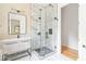 Modern bathroom featuring a glass-enclosed shower, vanity with marble countertop and stylish mirror at 1554 Columbia Cir, Decatur, GA 30032
