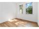 Bright bedroom featuring hardwood floors and dual windows providing ample natural light at 1554 Columbia Cir, Decatur, GA 30032