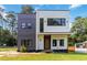 Striking two-story home with a modern design, featuring mixed siding and large windows at 1554 Columbia Cir, Decatur, GA 30032