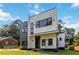 Modern residence showcasing a distinctive exterior with clean lines, expansive windows, and contrasting siding at 1554 Columbia Cir, Decatur, GA 30032
