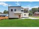 Modern two-story home with a balcony, beautiful lawn, and sleek exterior design at 1554 Columbia Cir, Decatur, GA 30032