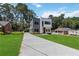 Modern two-story home with long driveway, manicured front yard, and well-kept lawn at 1554 Columbia Cir, Decatur, GA 30032