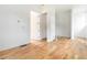 Bright hallway with an open doorway, hardwood floors and white walls at 1554 Columbia Cir, Decatur, GA 30032