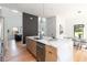 Modern kitchen boasting white marble countertops, wooden cabinets and an eat in kitchen island at 1554 Columbia Cir, Decatur, GA 30032