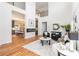 Modern living space with an open floor plan, fireplace, and kitchen views at 1554 Columbia Cir, Decatur, GA 30032