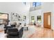 Bright living room with soaring ceilings, hardwood floors, and modern decor at 1554 Columbia Cir, Decatur, GA 30032