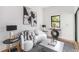 Modern living room with white couch, striped rug, and decor at 1554 Columbia Cir, Decatur, GA 30032
