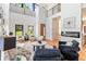 Spacious living room with soaring ceilings, a modern fireplace, and an open layout at 1554 Columbia Cir, Decatur, GA 30032