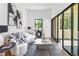 Modern living room featuring stylish decor, access to the outdoors, and contemporary art at 1554 Columbia Cir, Decatur, GA 30032
