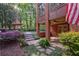 Lush backyard with stone path leading to pool, patio, and beautifully landscaped grounds at 1984 Mendenhall Cir, Atlanta, GA 30341