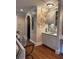 Stylish bar area with sleek cabinets, mosaic tile backsplash, and decorative art at 1984 Mendenhall Cir, Atlanta, GA 30341