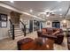 Finished basement showcasing stairs, sofa, coffee table, wet bar, pool table, and laminate floors at 1984 Mendenhall Cir, Atlanta, GA 30341