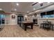 Finished basement with a dart board, pool table, fireplace, and wood-look laminate floors at 1984 Mendenhall Cir, Atlanta, GA 30341
